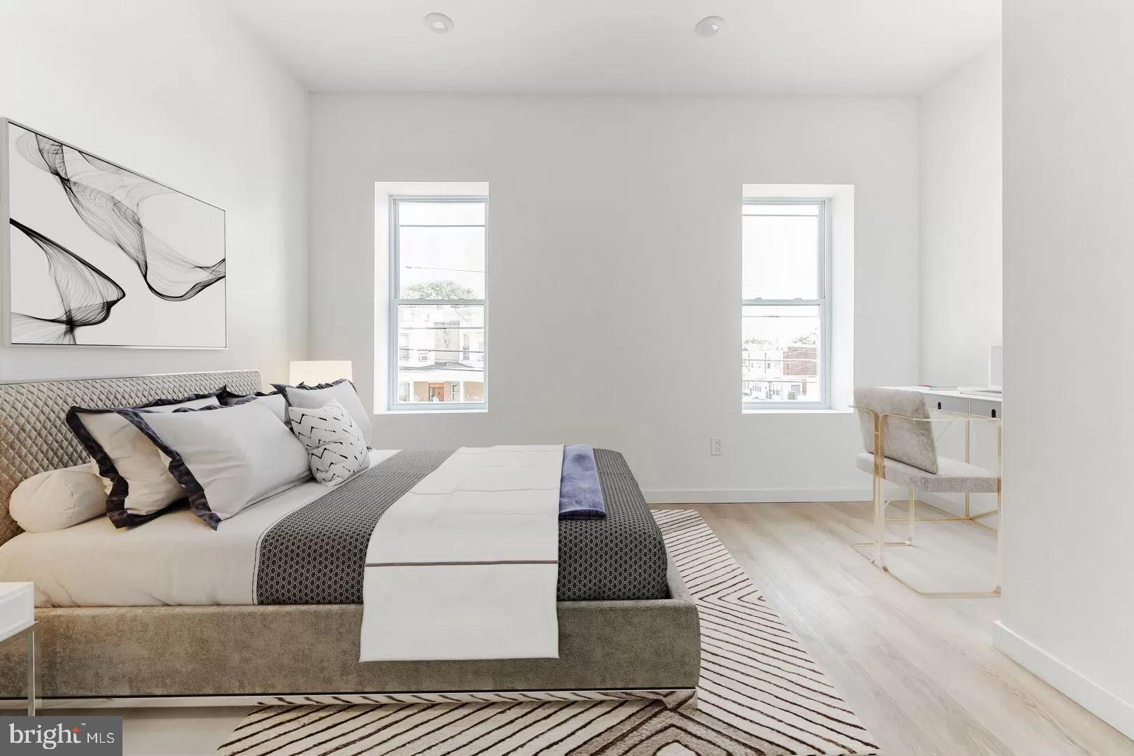 a bedroom with a large bed and a window