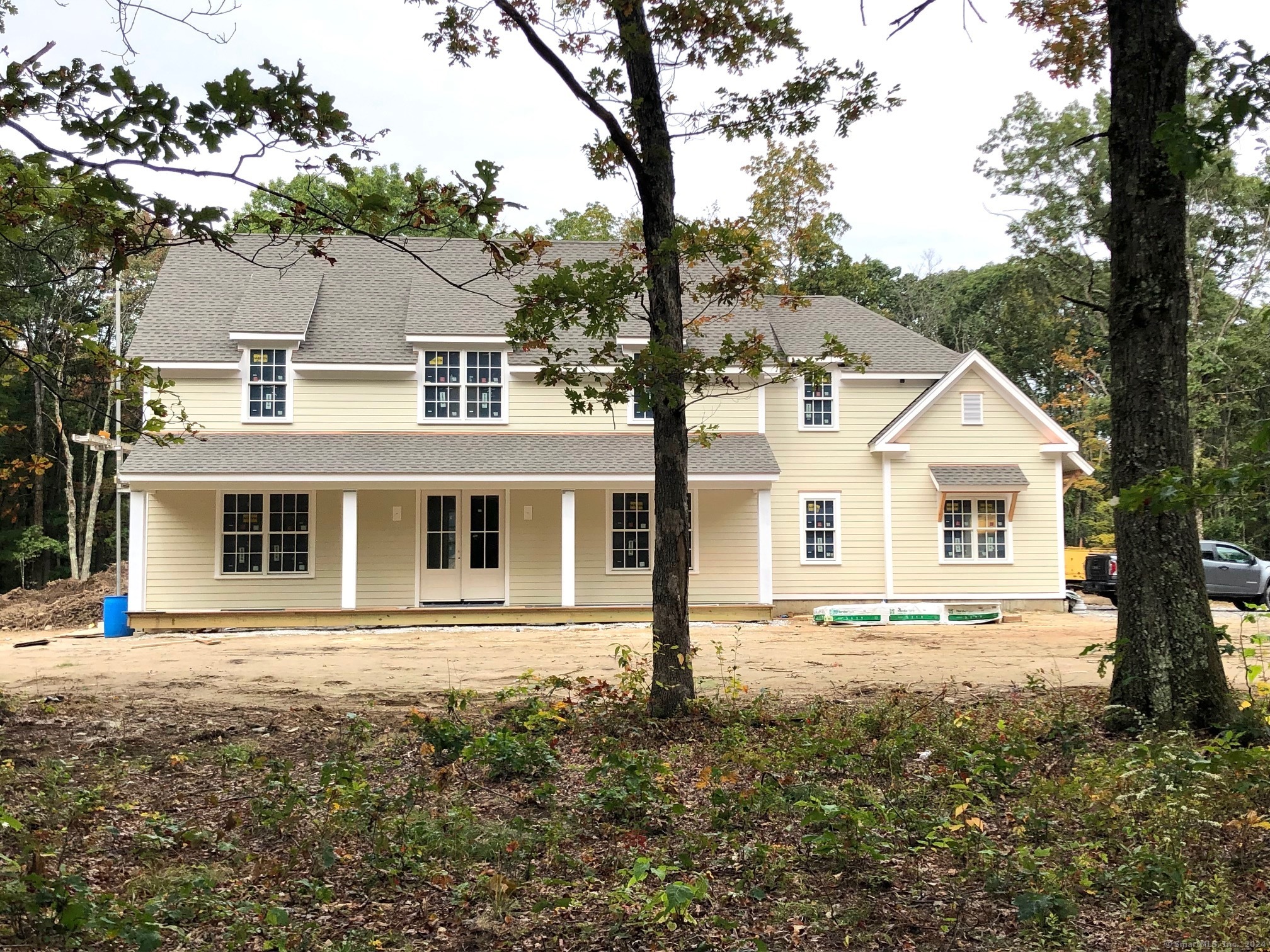 a front view of a house with a yard