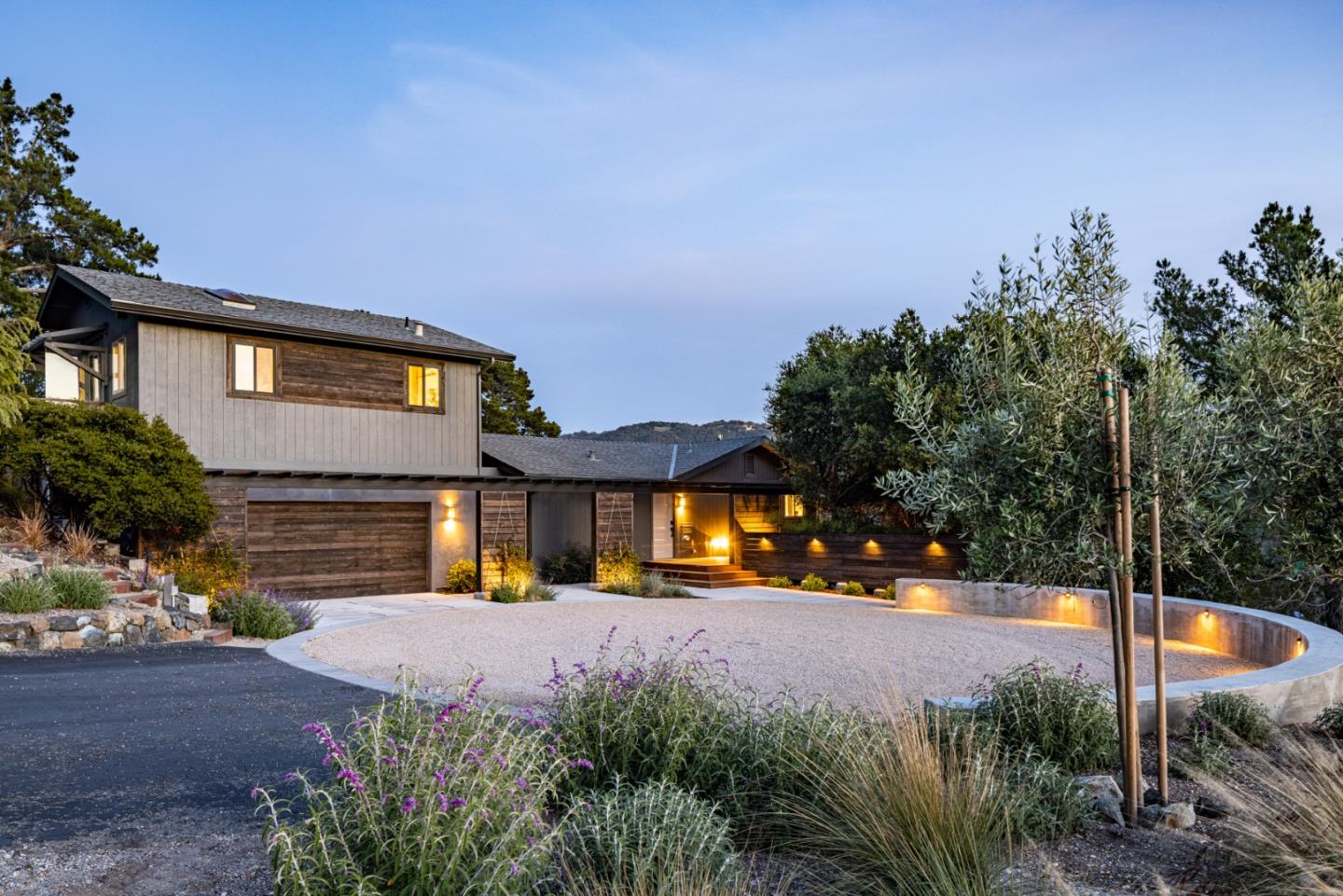 a view of a house with a yard next to a road