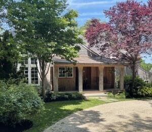 front view of a house with a garden