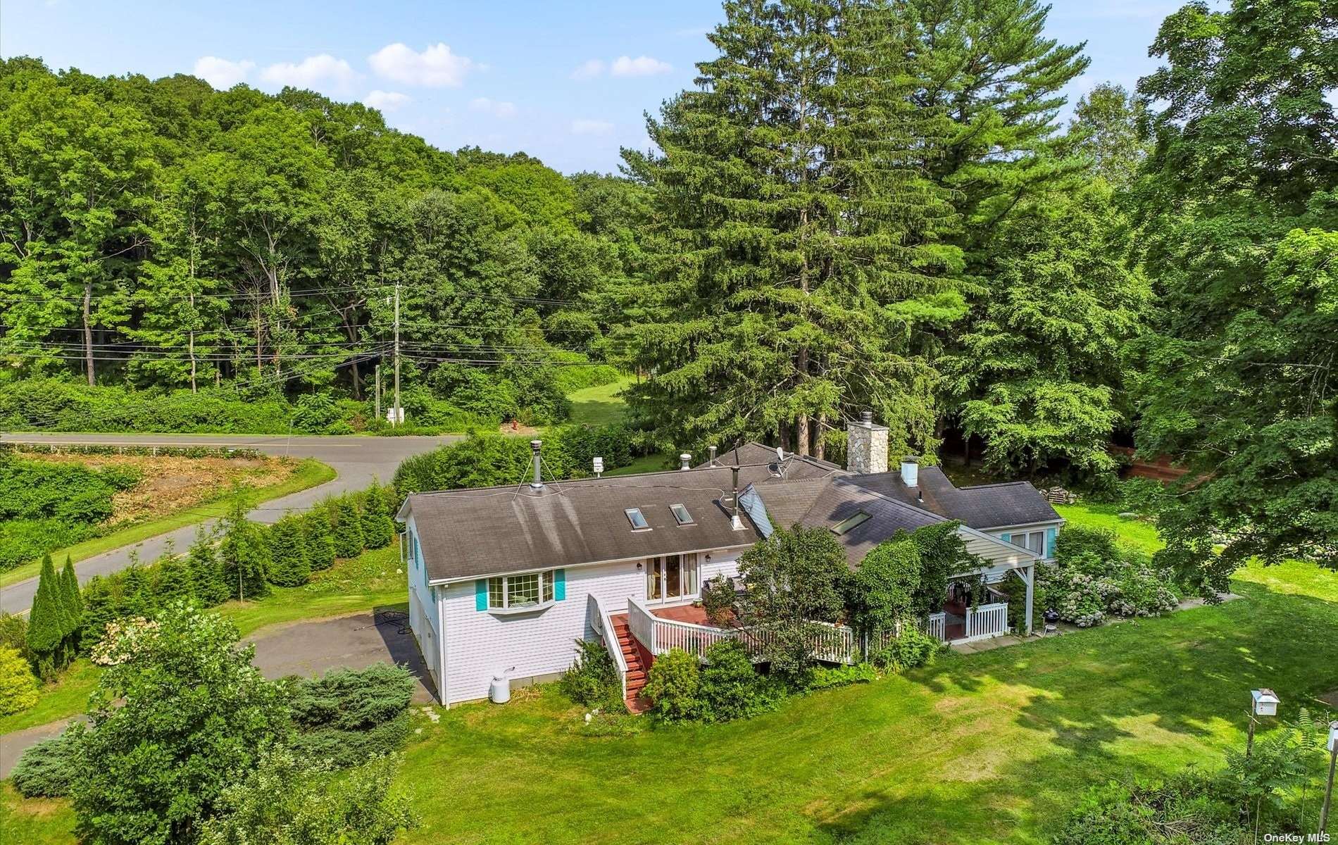 an aerial view of a house with a garden