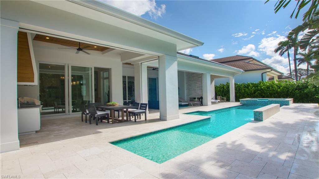 a view of a house with garden and a patio