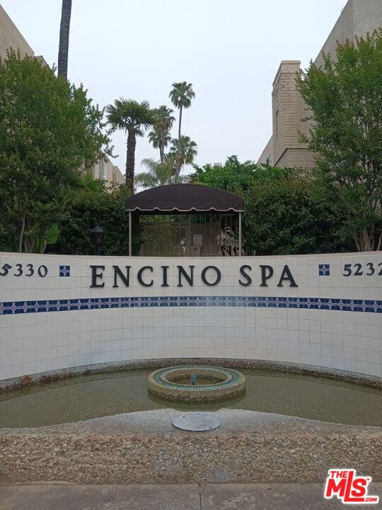 a view of a swimming pool and outdoor seating