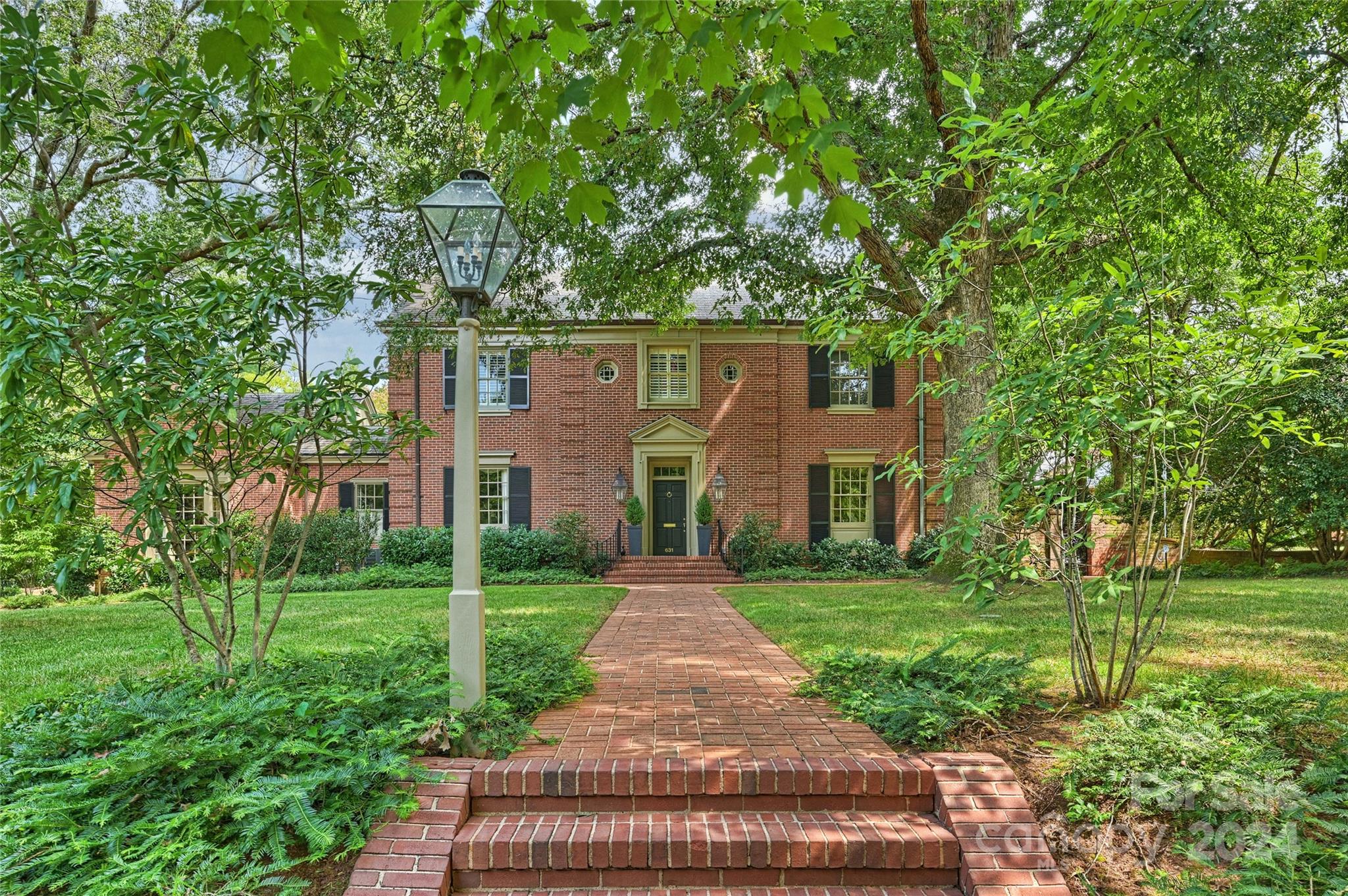 a front view of a house with yard