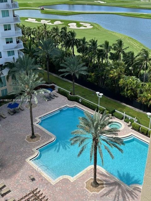 a view of a swimming pool with a patio