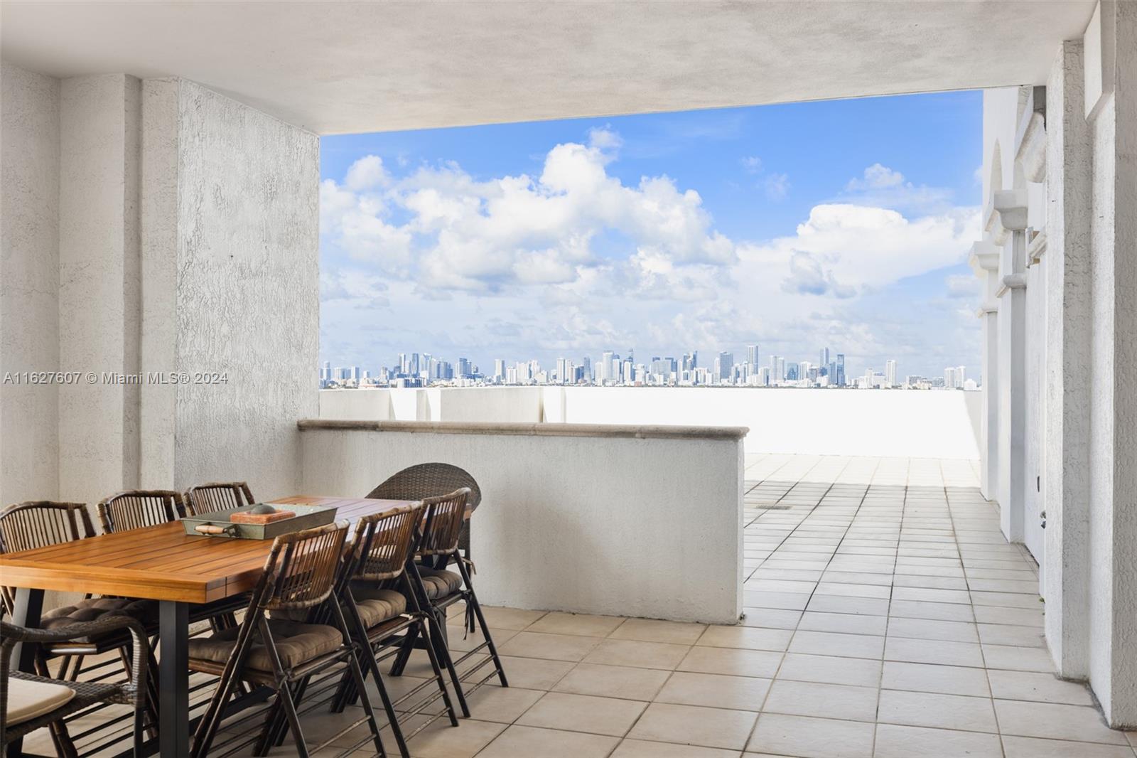 a terrace with a table and chairs