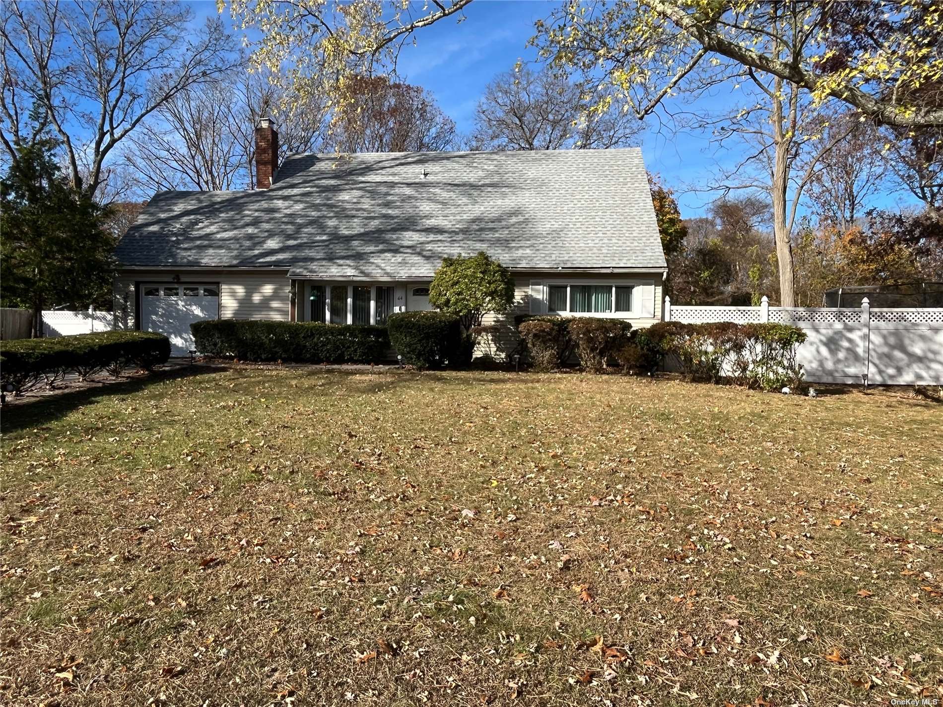 a view of house with a yard