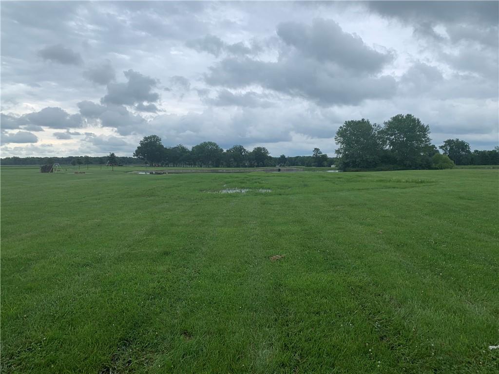 a view of field with an house and background