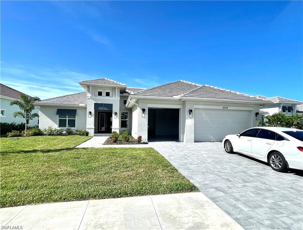 a front view of a house with a yard