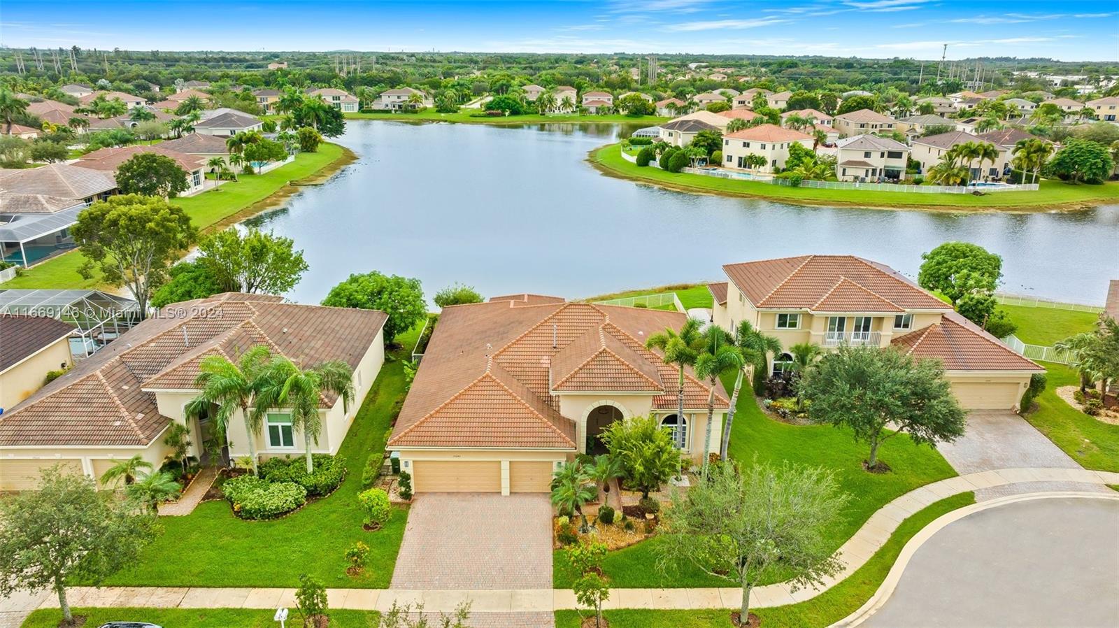 an aerial view of a house with a lake view