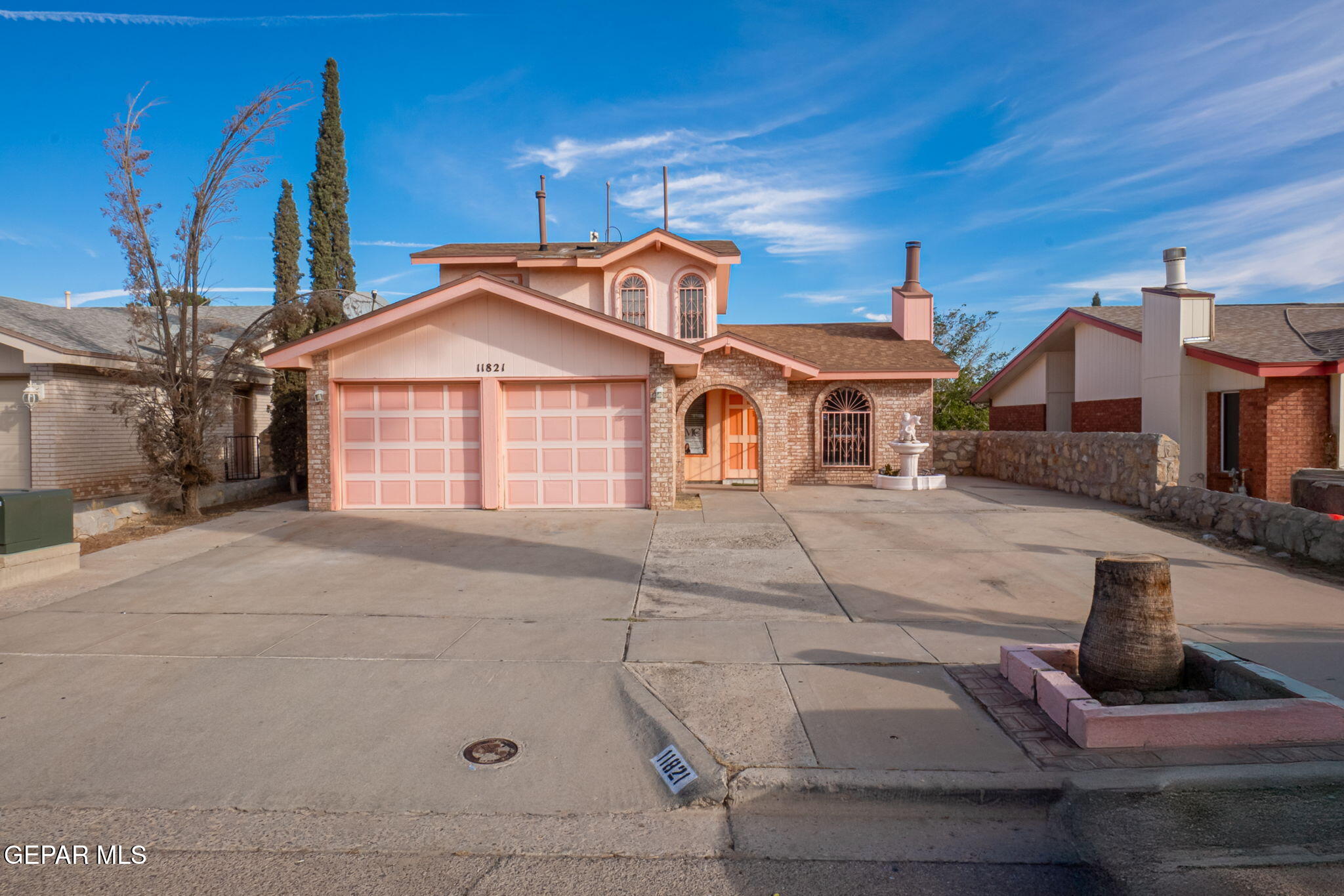 a front view of a house with garage