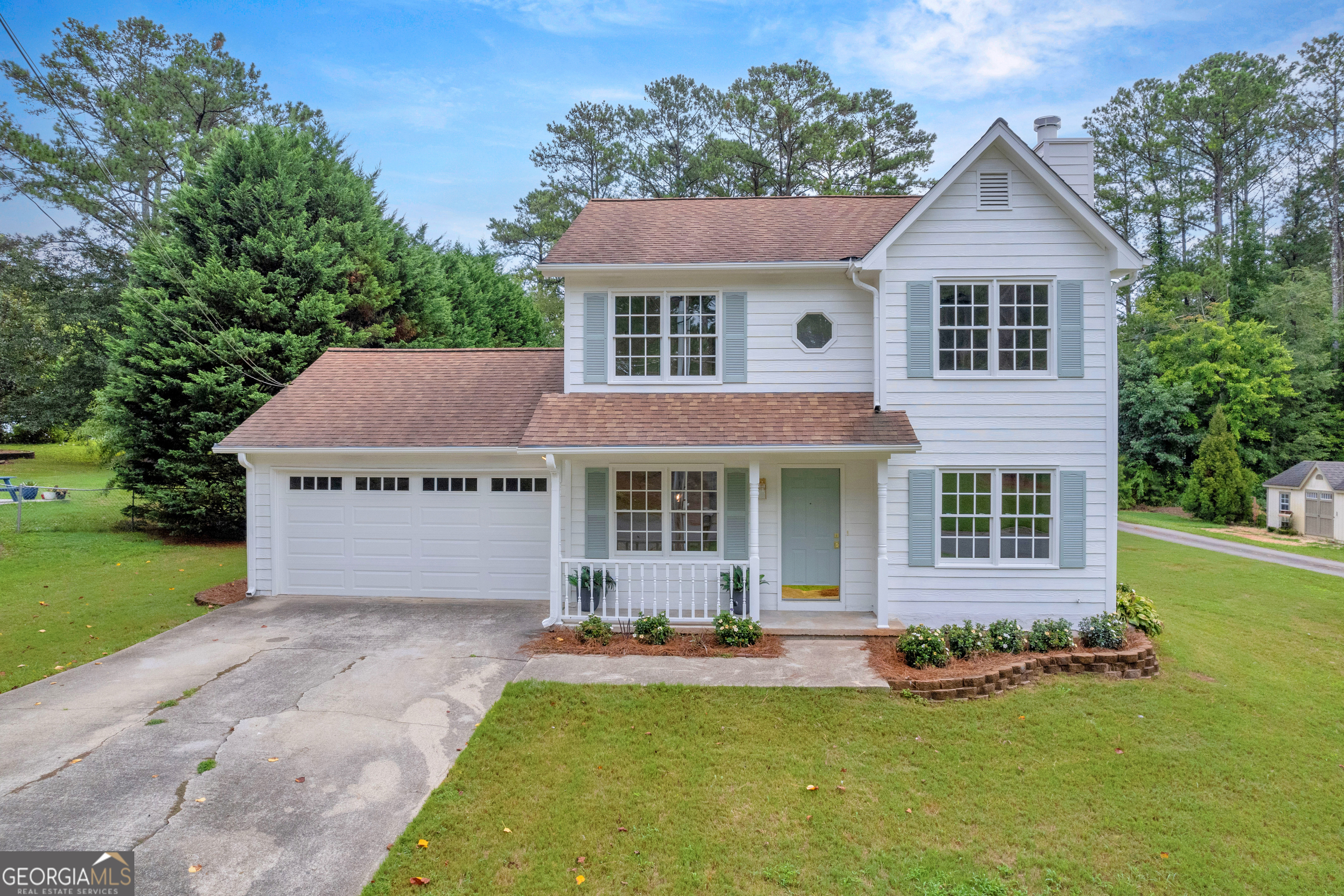 front view of a house with a yard