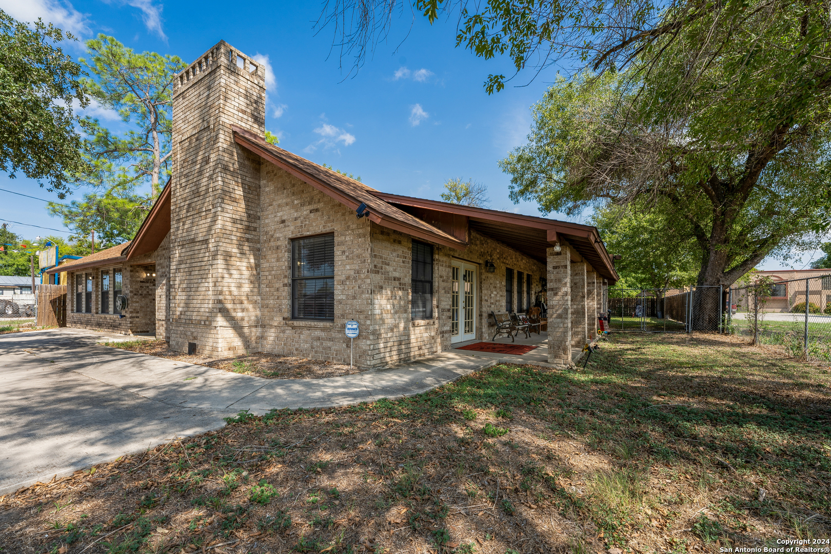 a front view of house with a garden