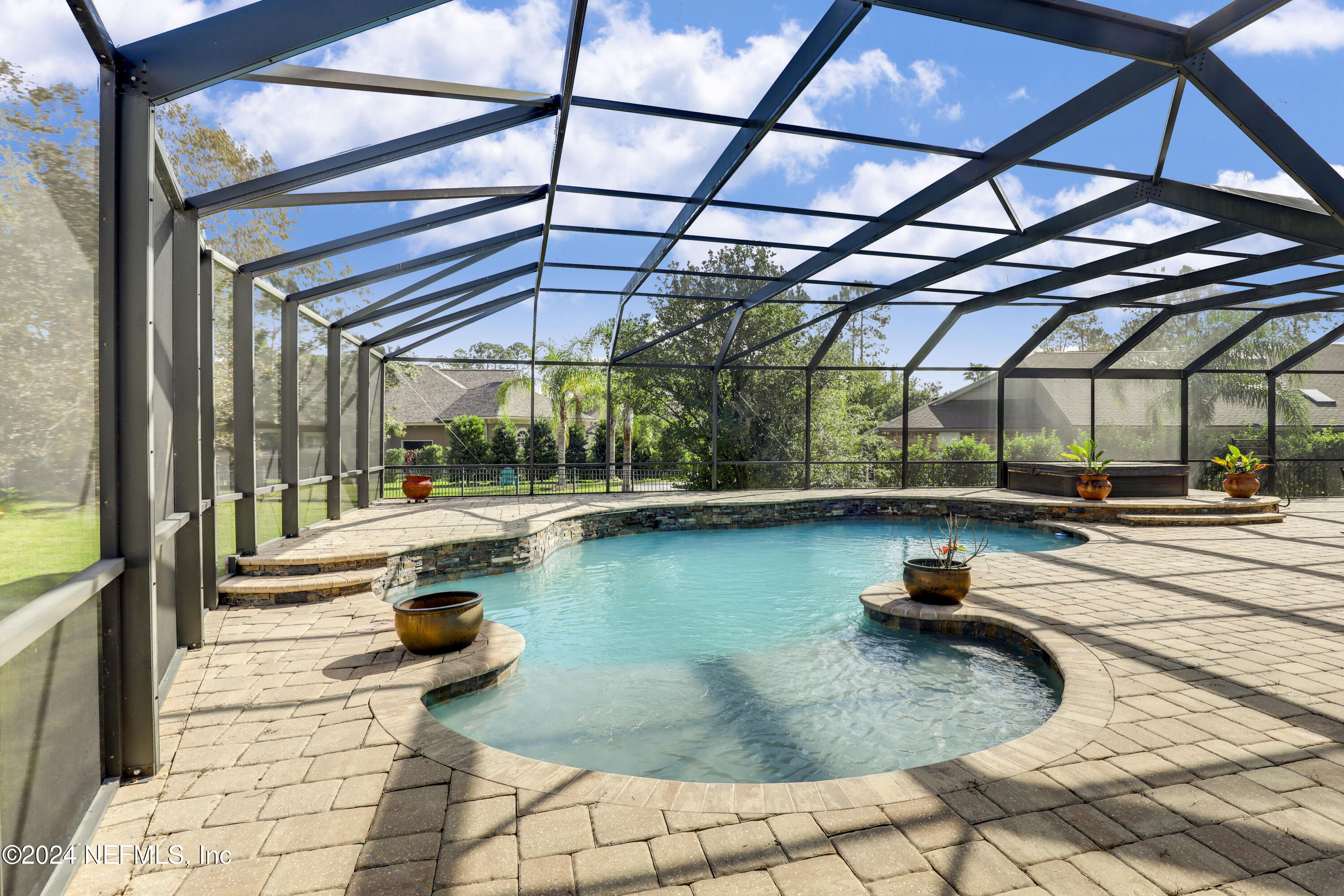 a view of swimming pool with outdoor seating