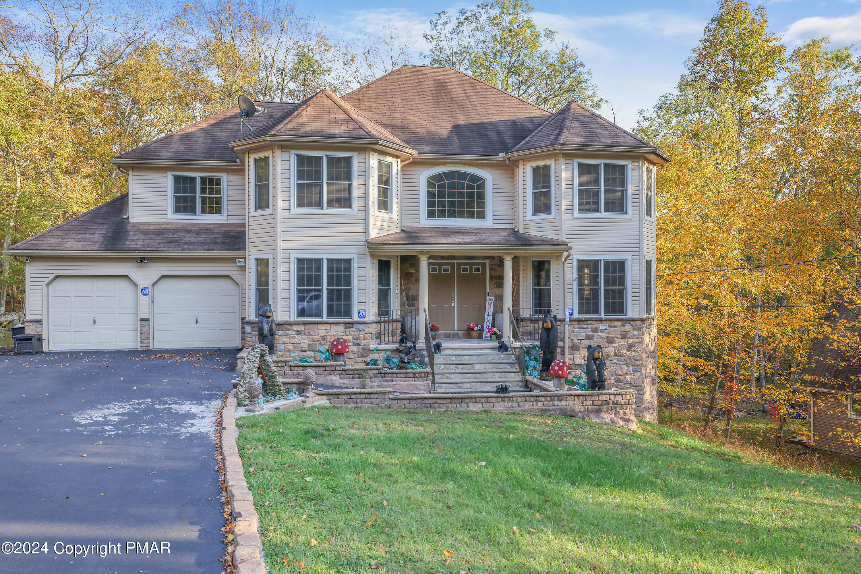 a front view of a house with outdoor seating