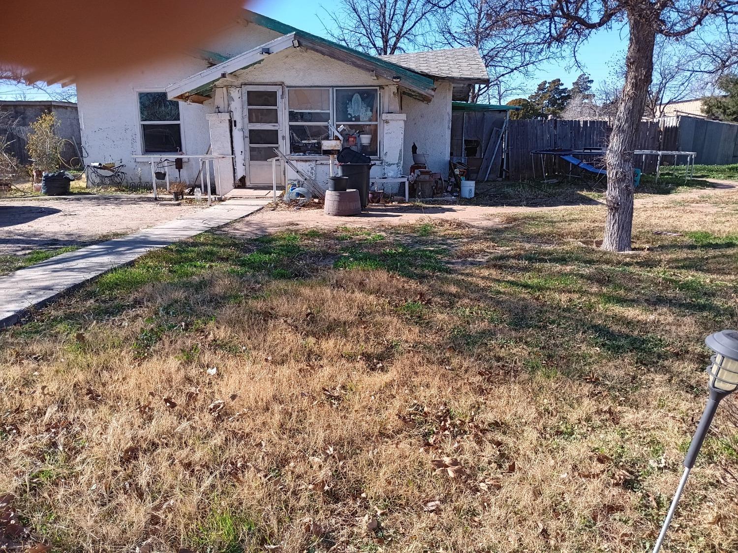 a front view of a house with yard and seating area