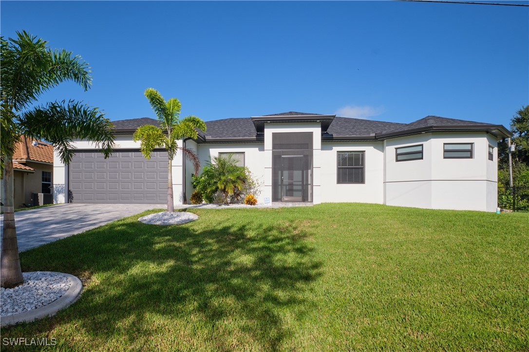 a front view of a house with a yard