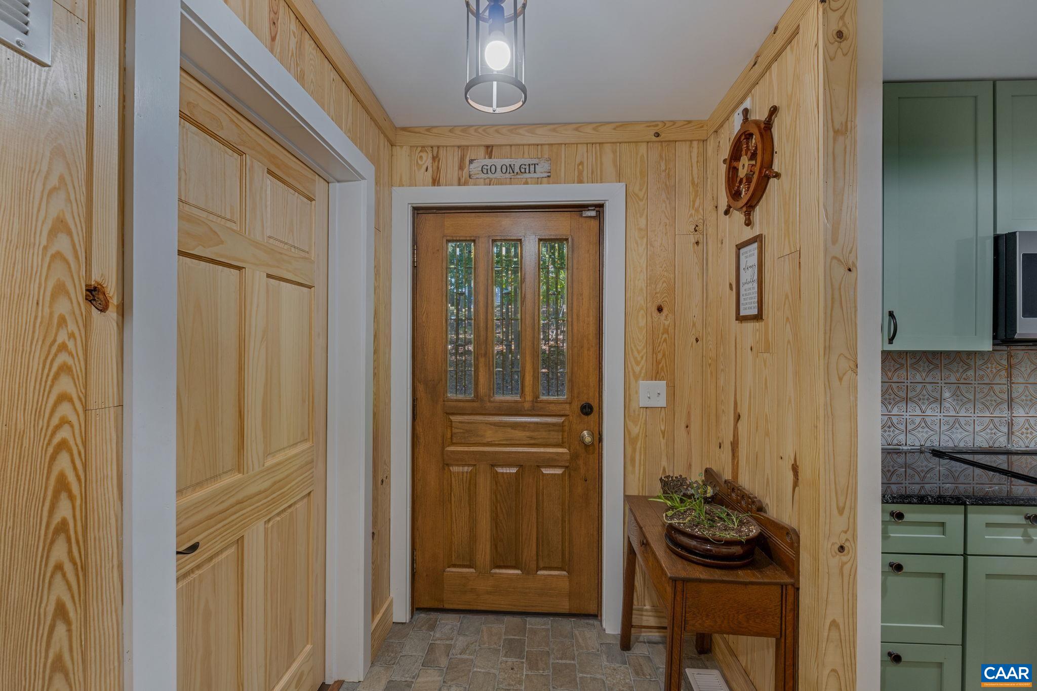 a bathroom with a mirror and a shower