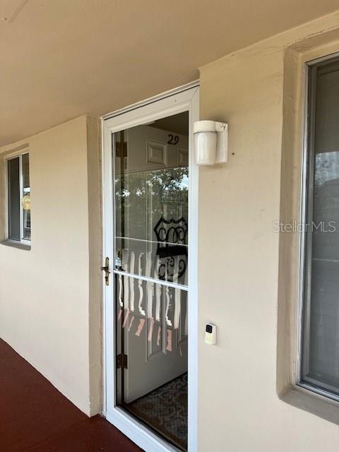 a view of a door and chair in a room