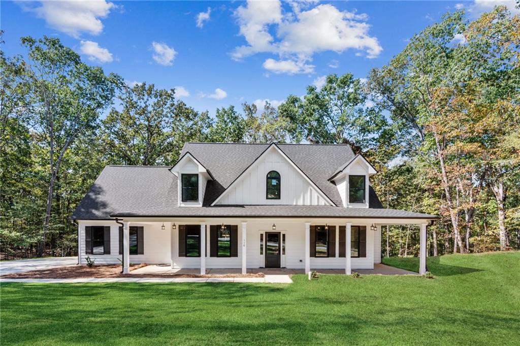 front view of a house with a yard