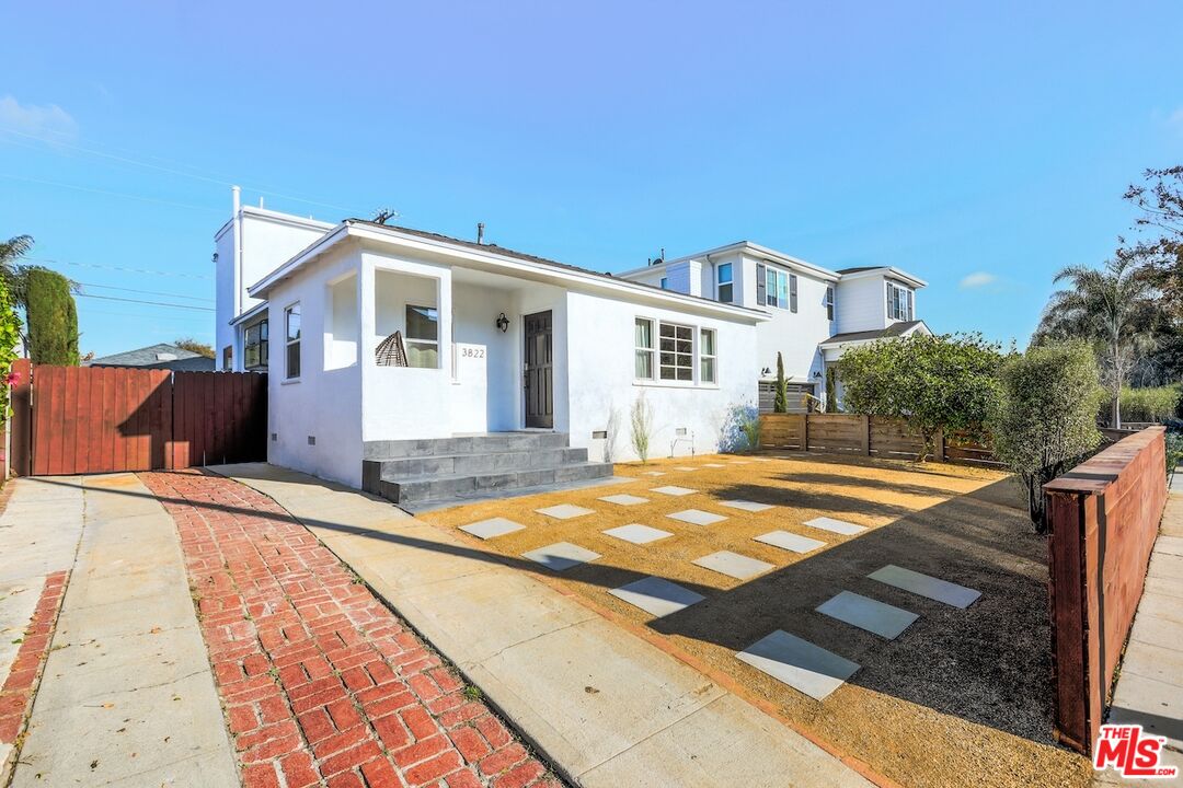 a front view of a house with yard