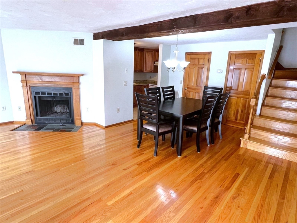 a view of a livingroom with furniture and a fireplace