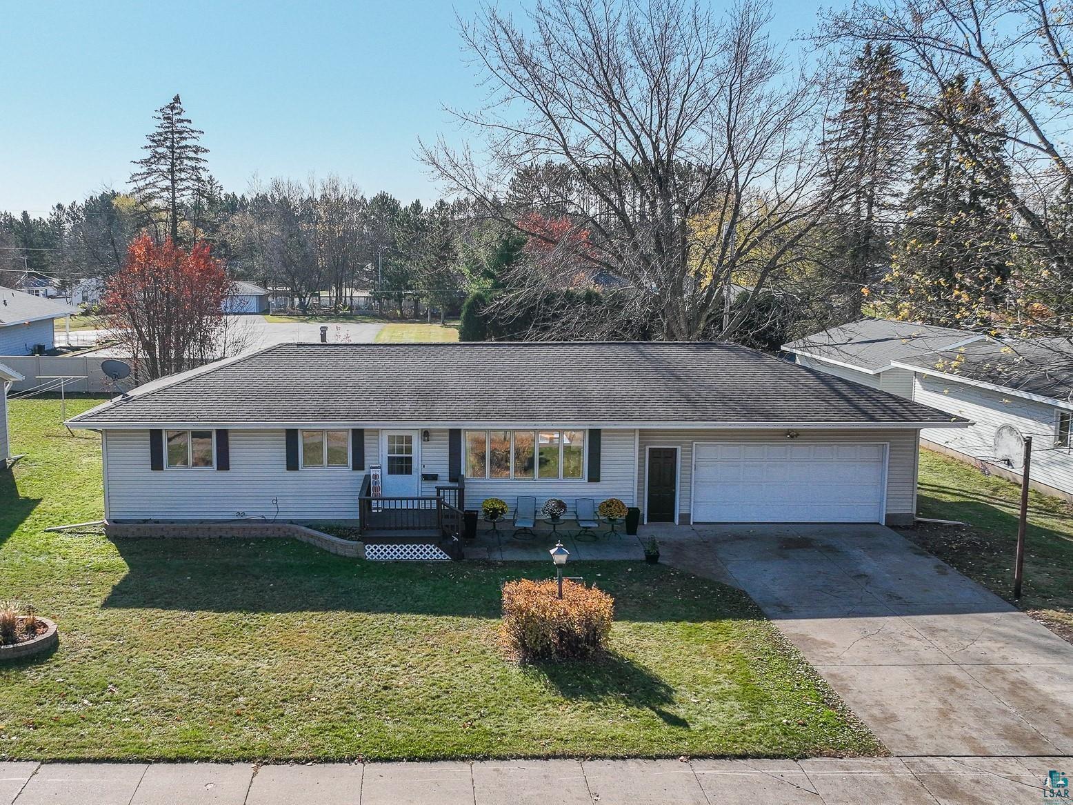 Single story home featuring a front lawn and a garage