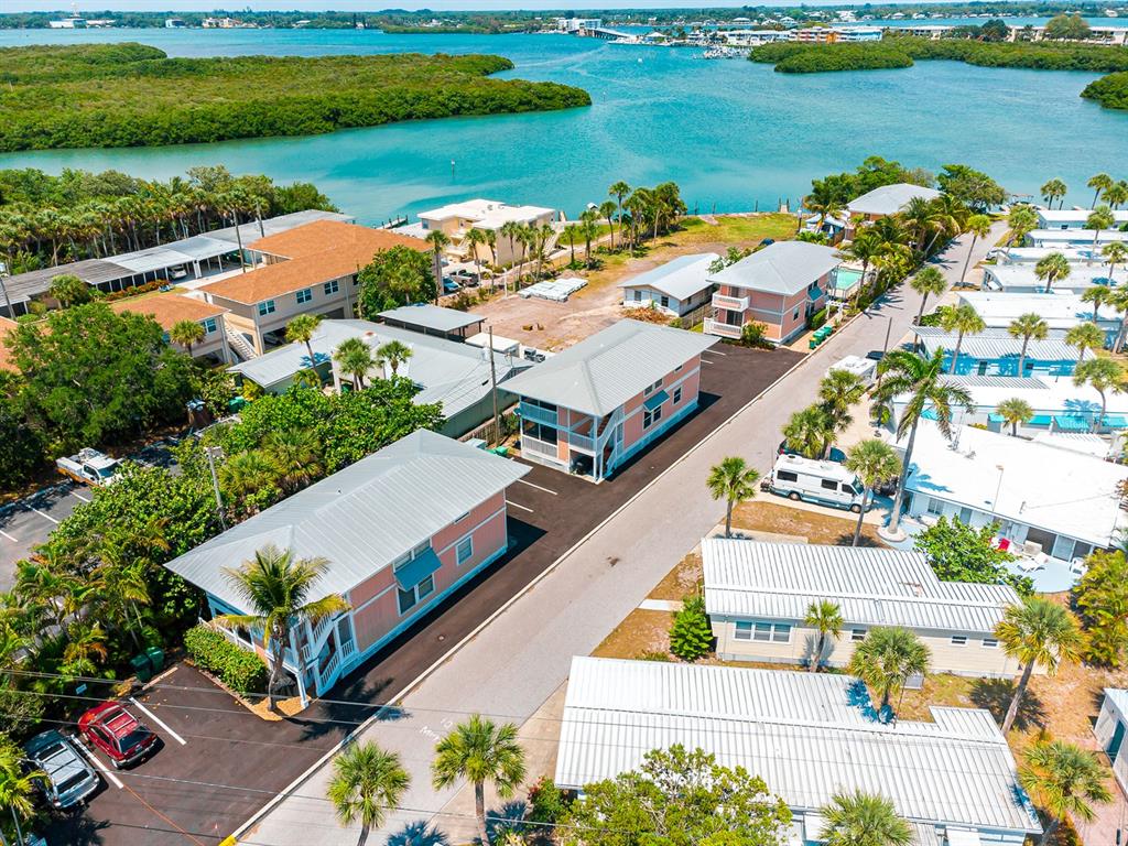 an aerial view of a house with a lake view