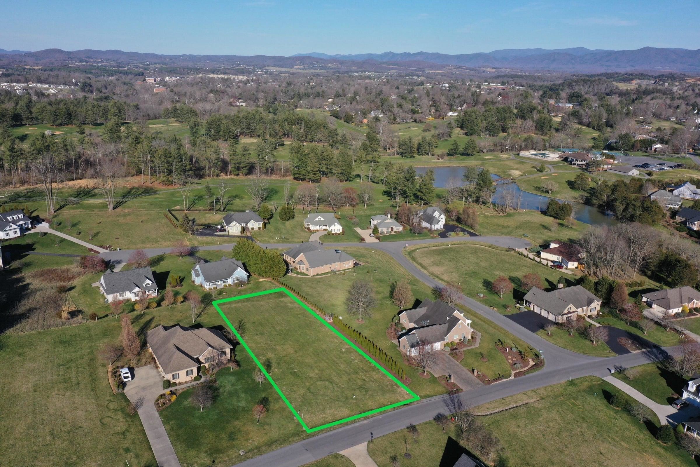 an aerial view of a residential houses and outdoor space