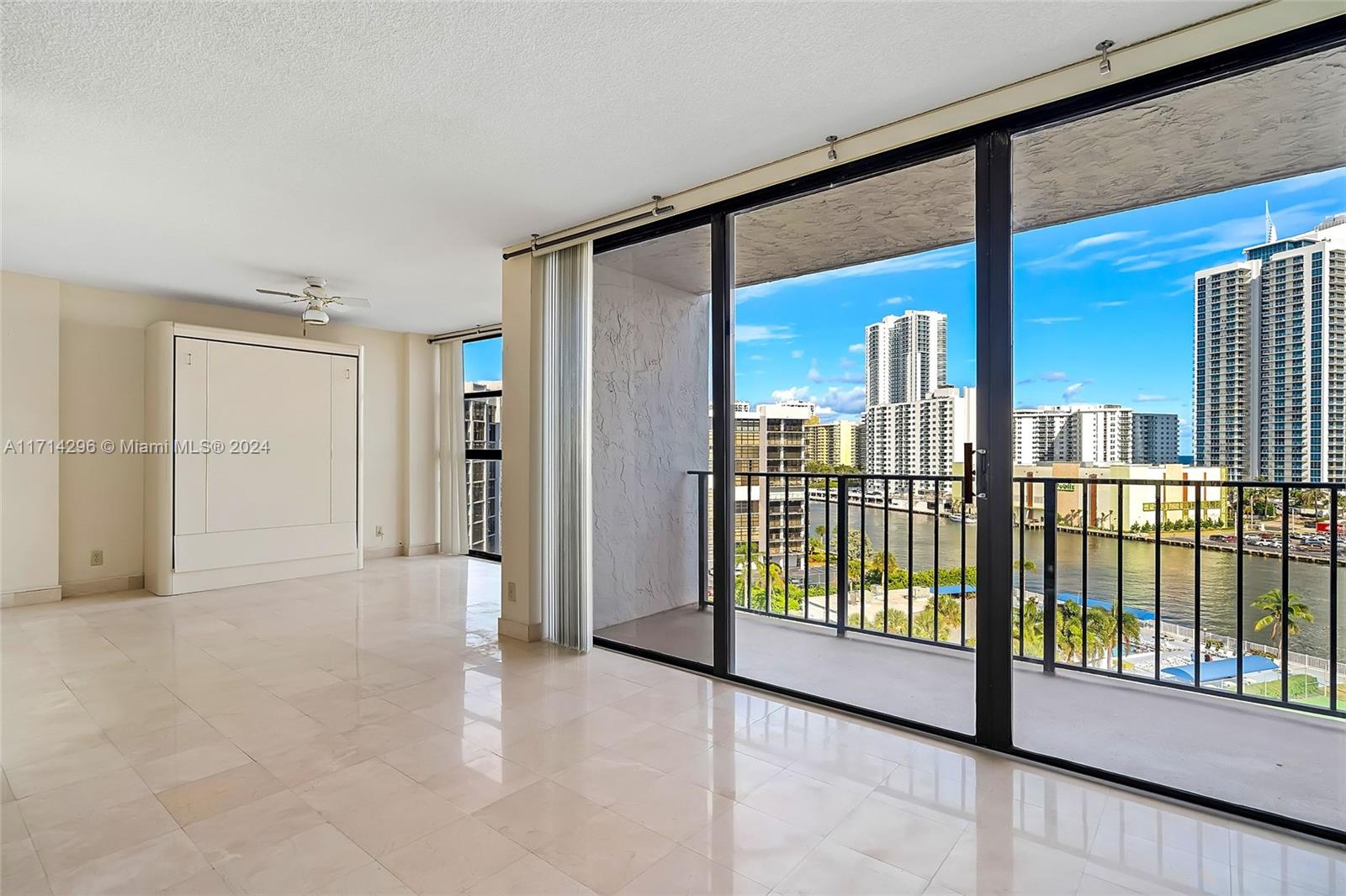 a view of empty room with floor to ceiling window