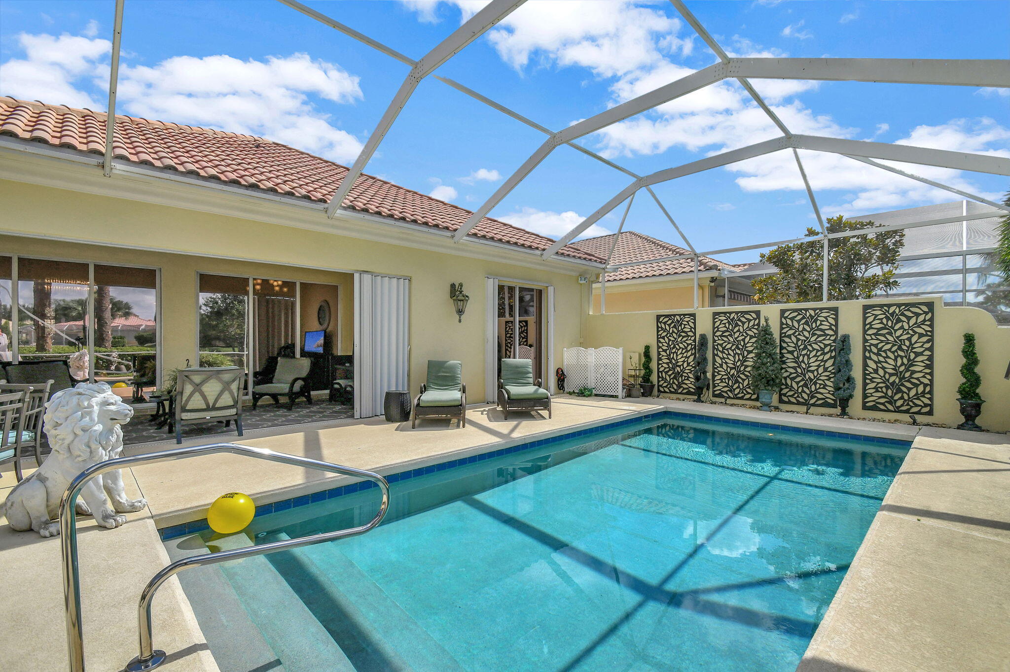 a view of swimming pool with outdoor seating