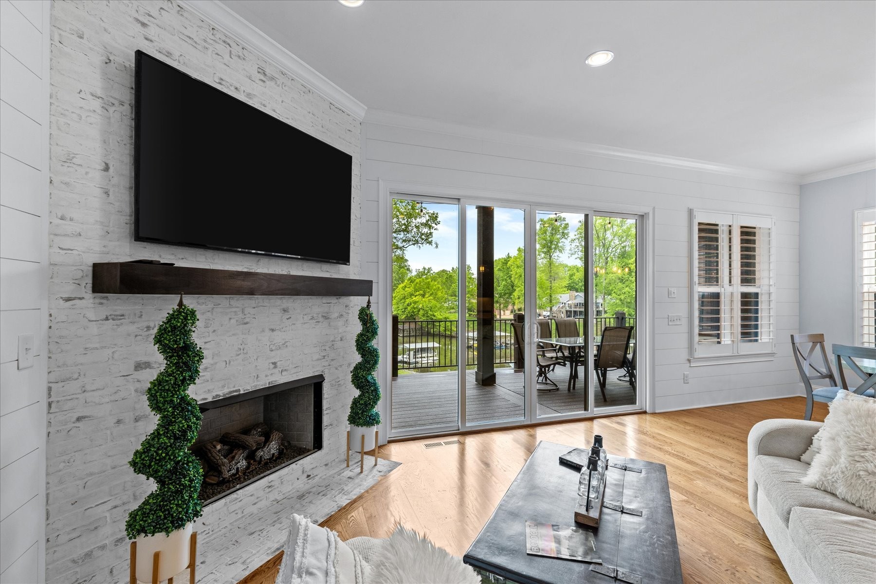 a living room with fireplace furniture and a flat screen tv