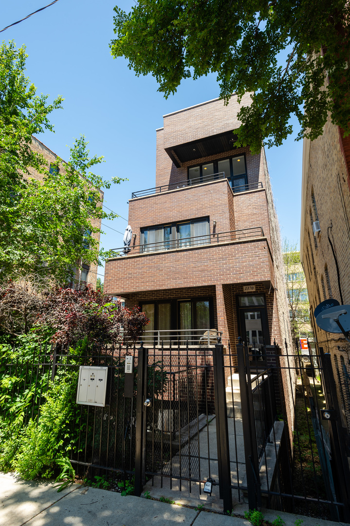 a front view of a house with parking area