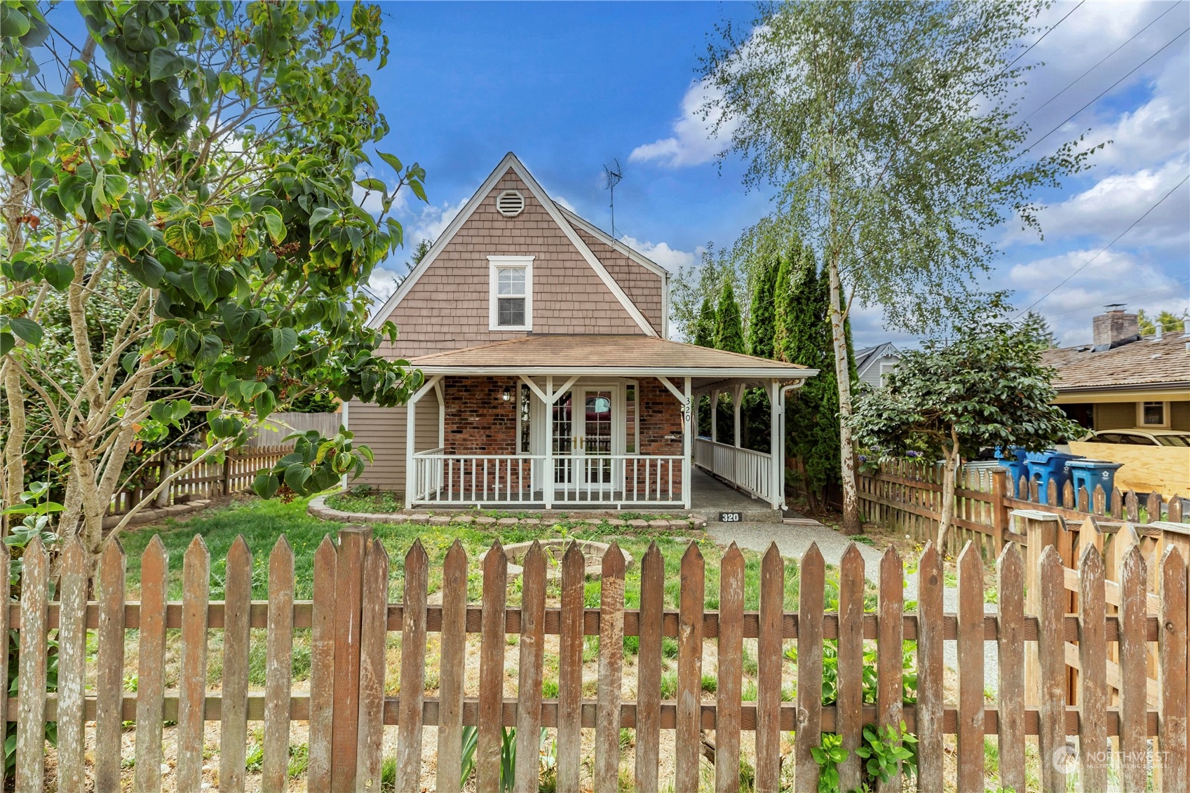 a front view of a house with a small yard