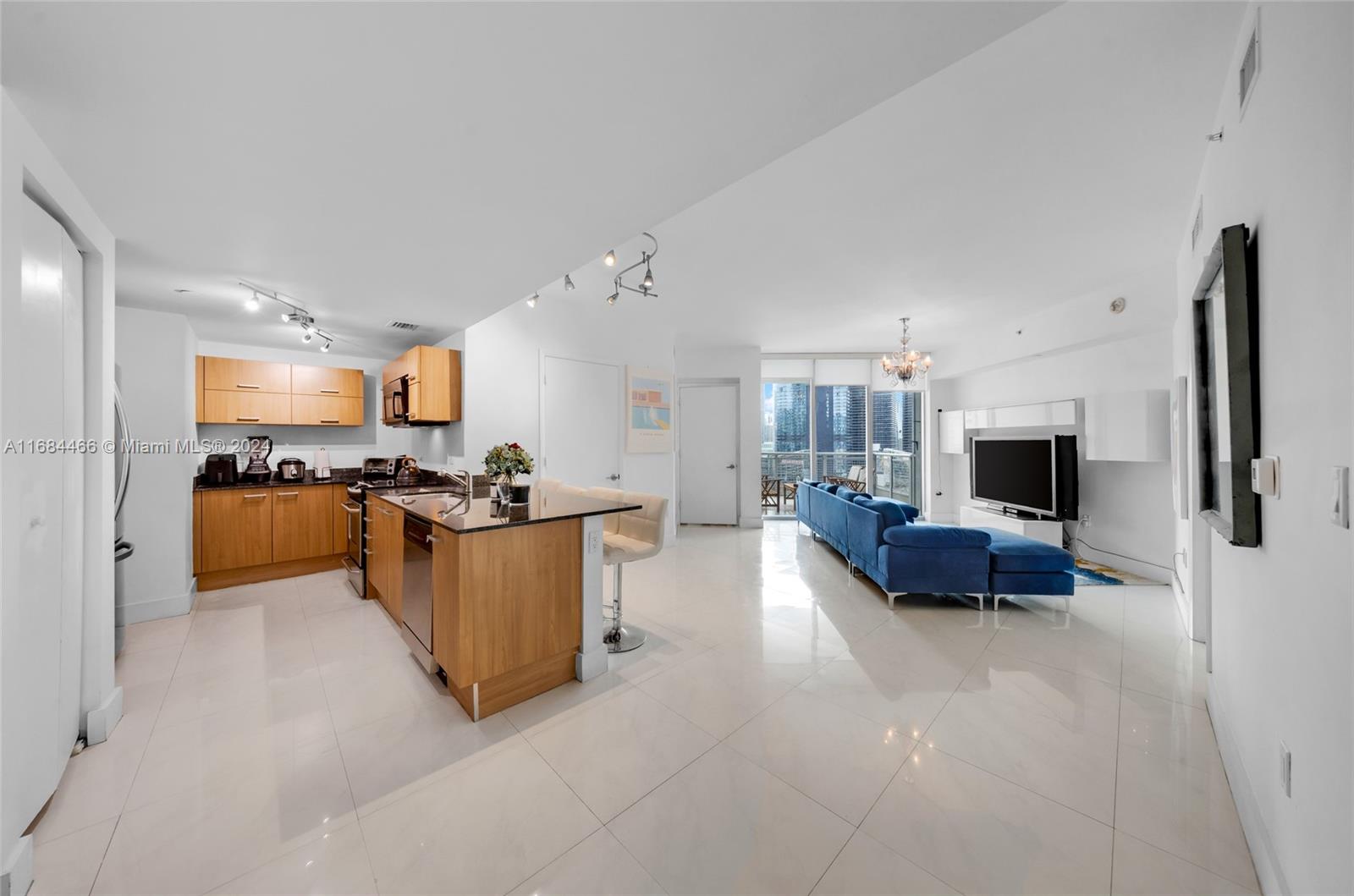 a large living room with furniture and a flat screen tv