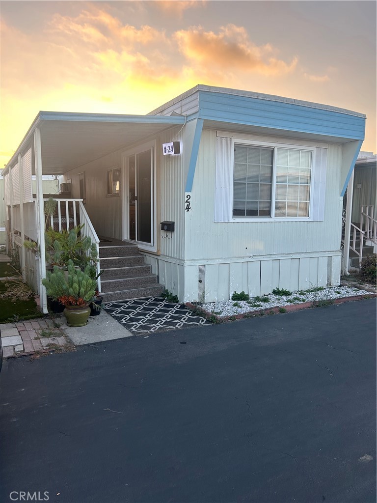 a view of a house with a street