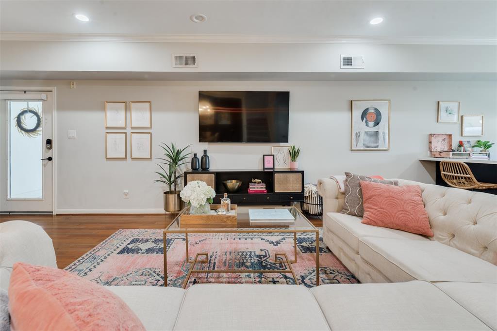 First floor living space open to kitchen and dining areas