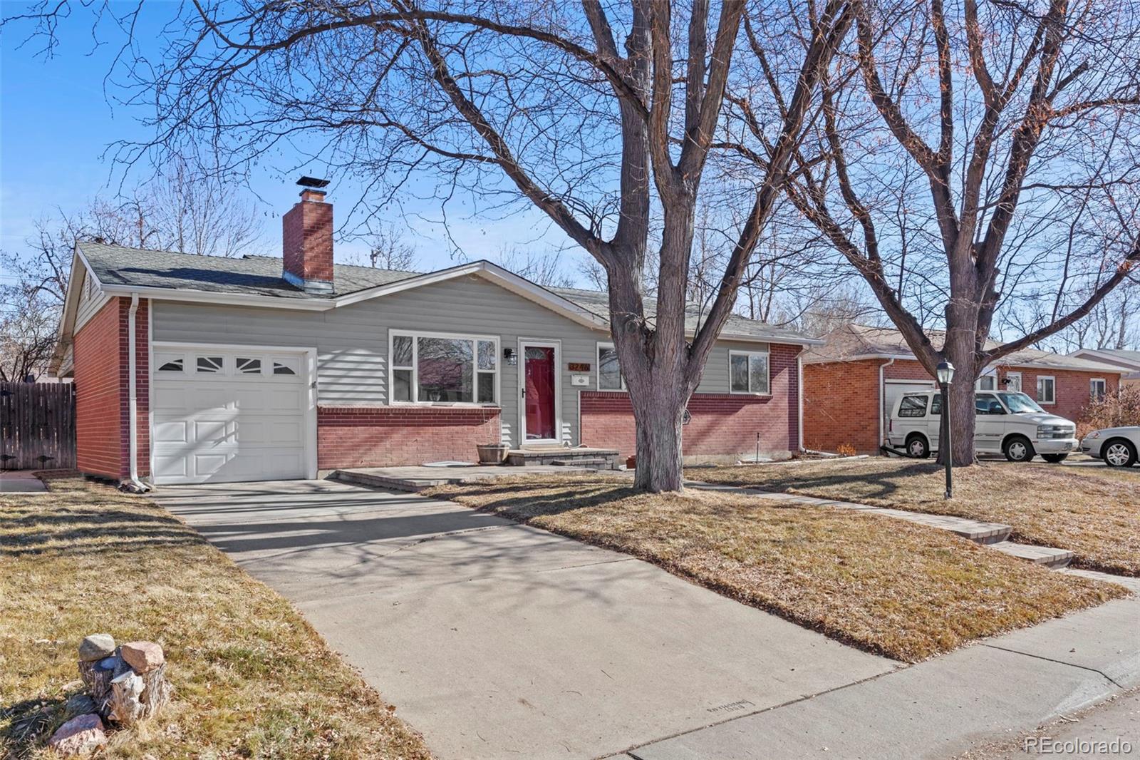 a front view of a house with a snow yard