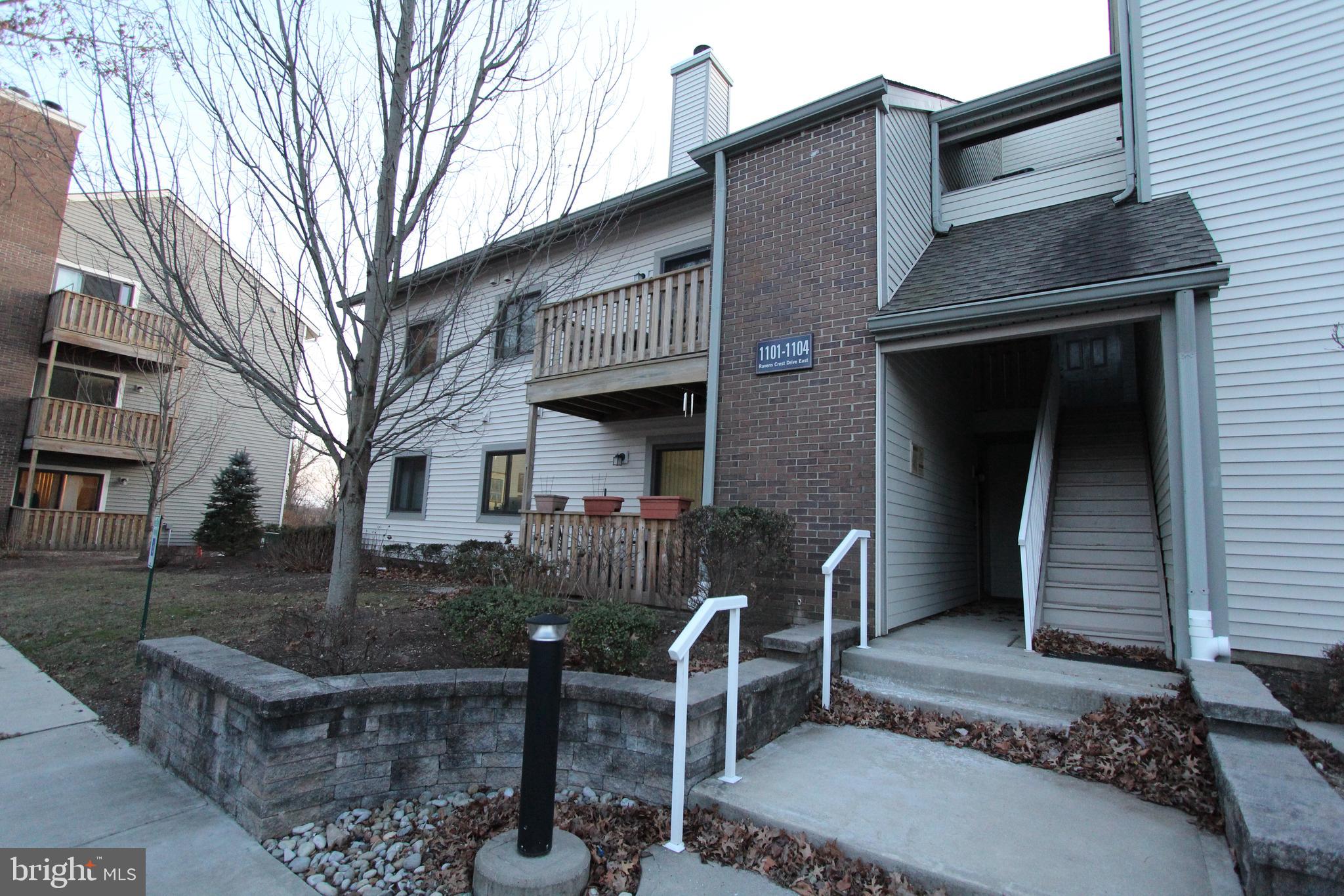 a front view of house with outdoor seating