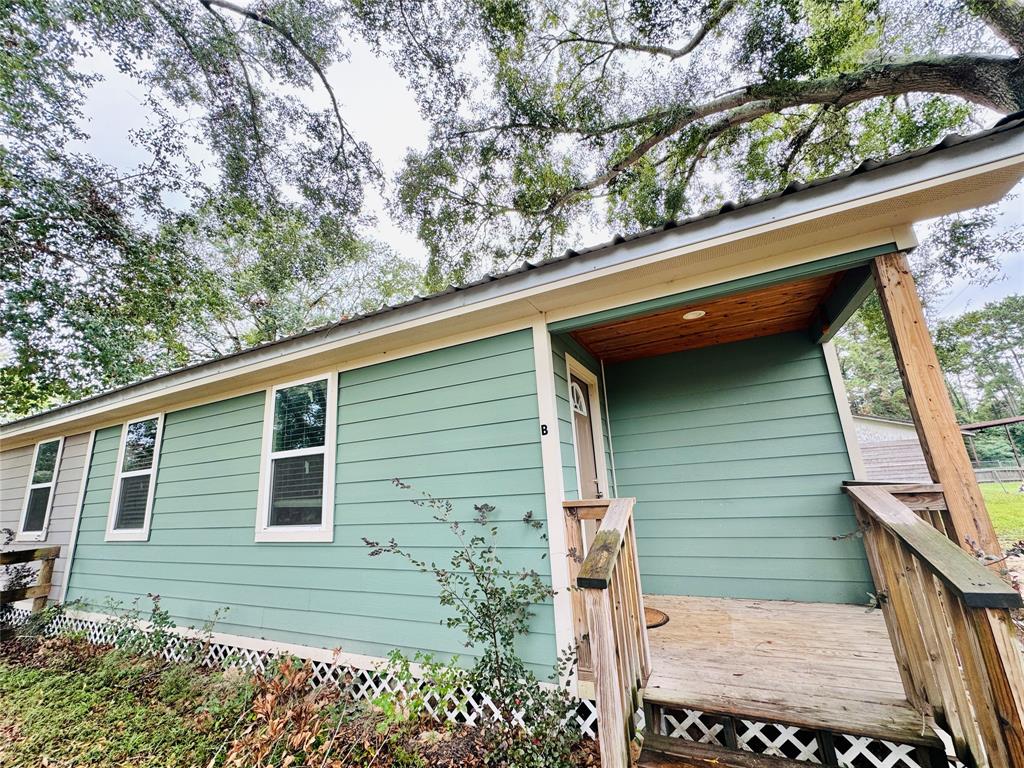 a view of a house with a tree