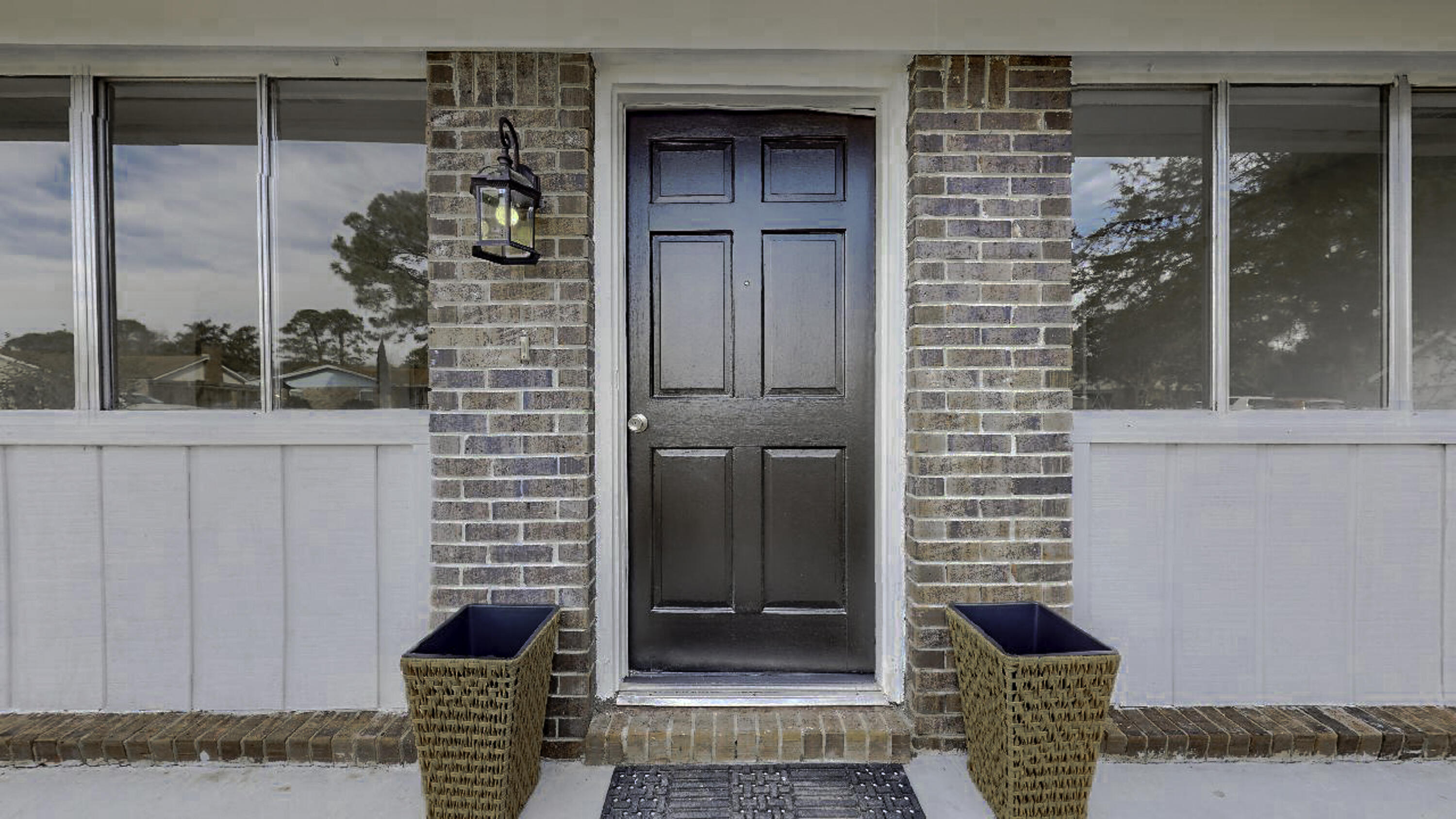 a front view of a house with a glass door