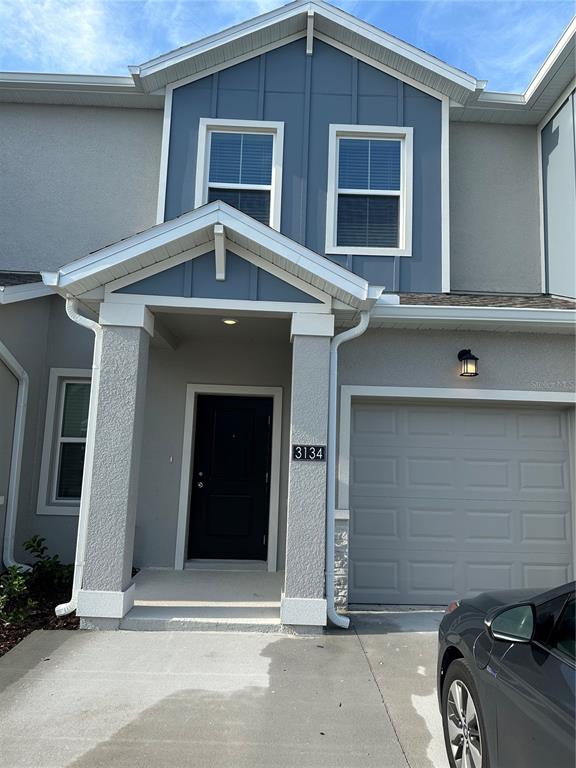 a front view of a house with garage