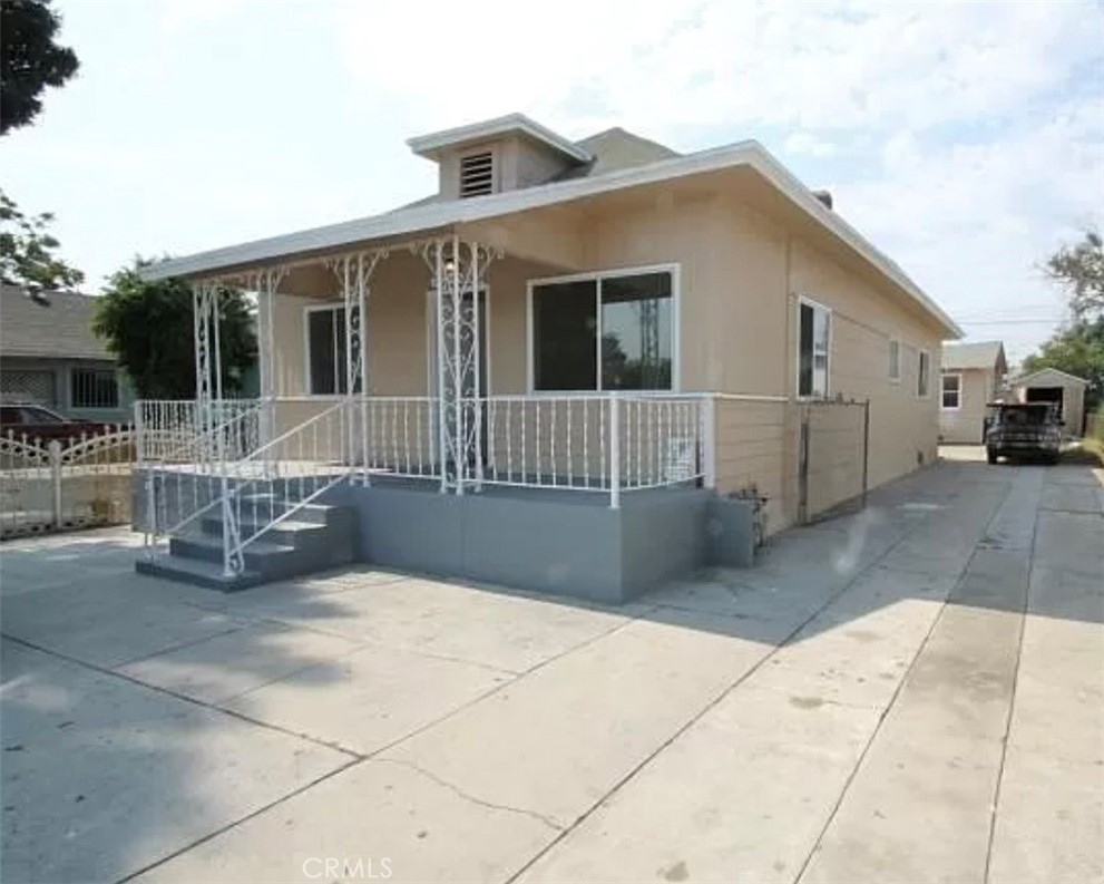 a front view of a house with a patio