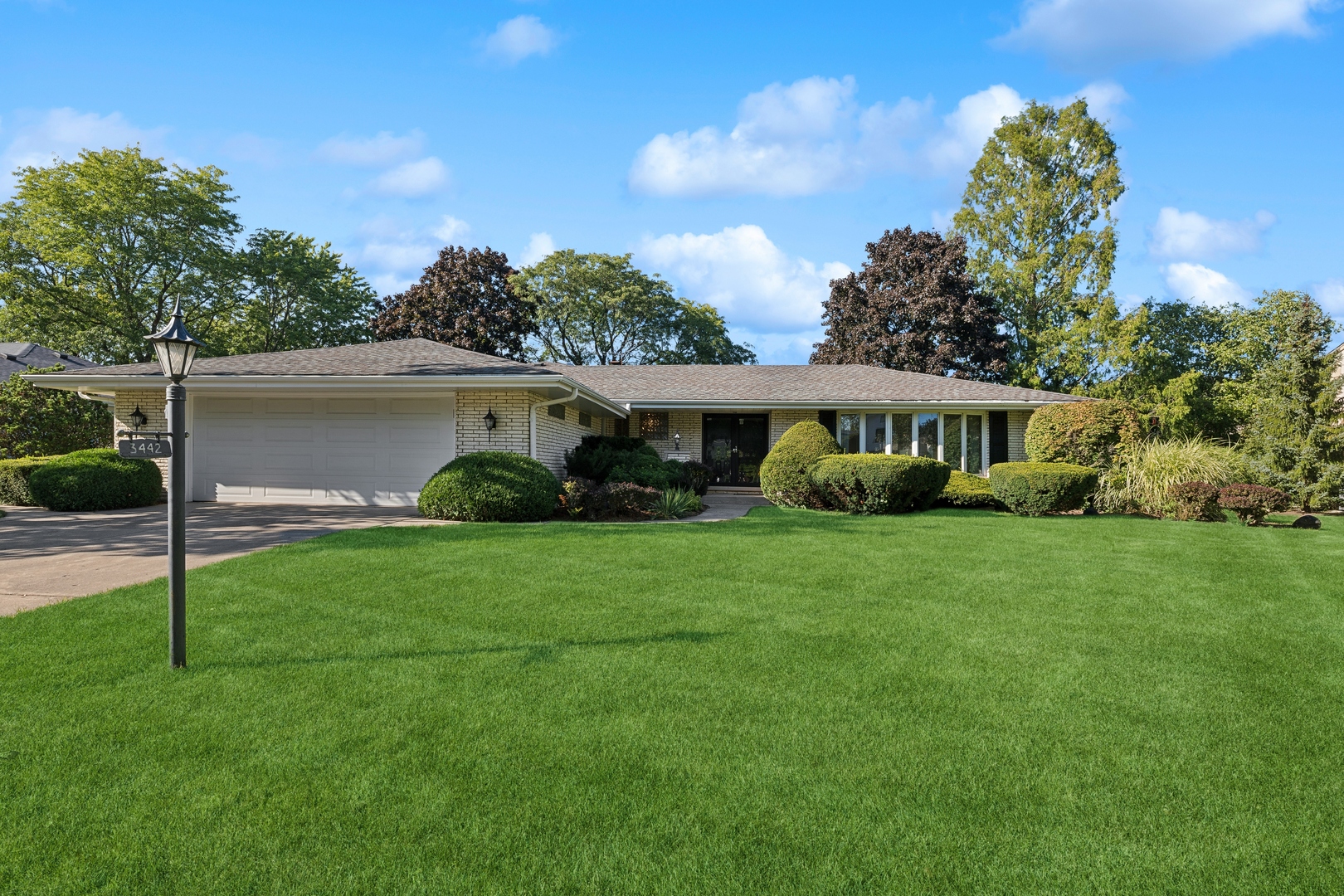 a front view of a house with garden