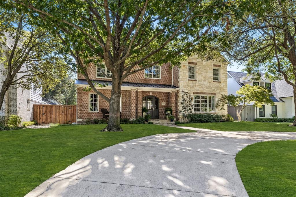 a view of a big yard in front of a house