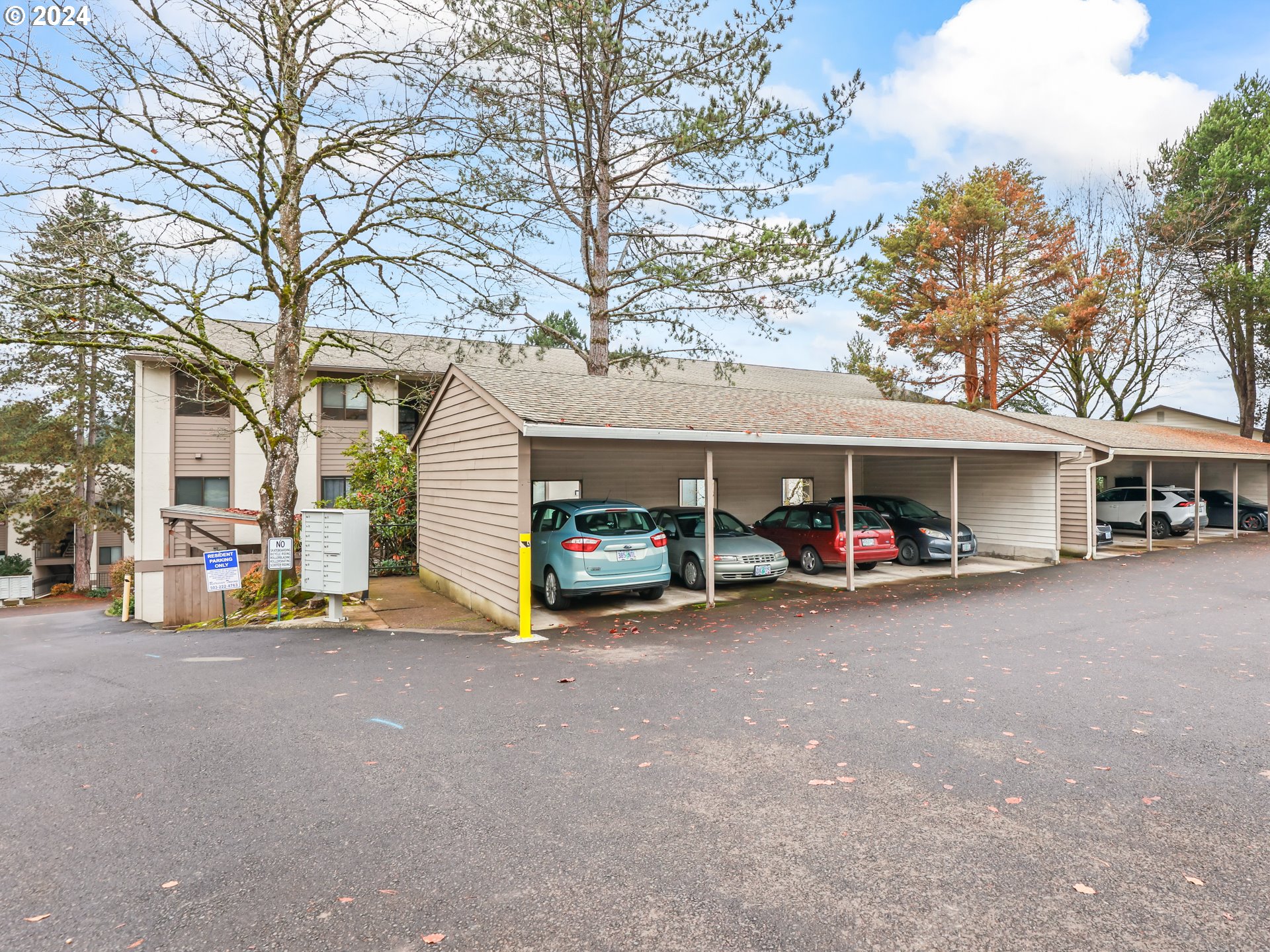 a view of a car park in front of house