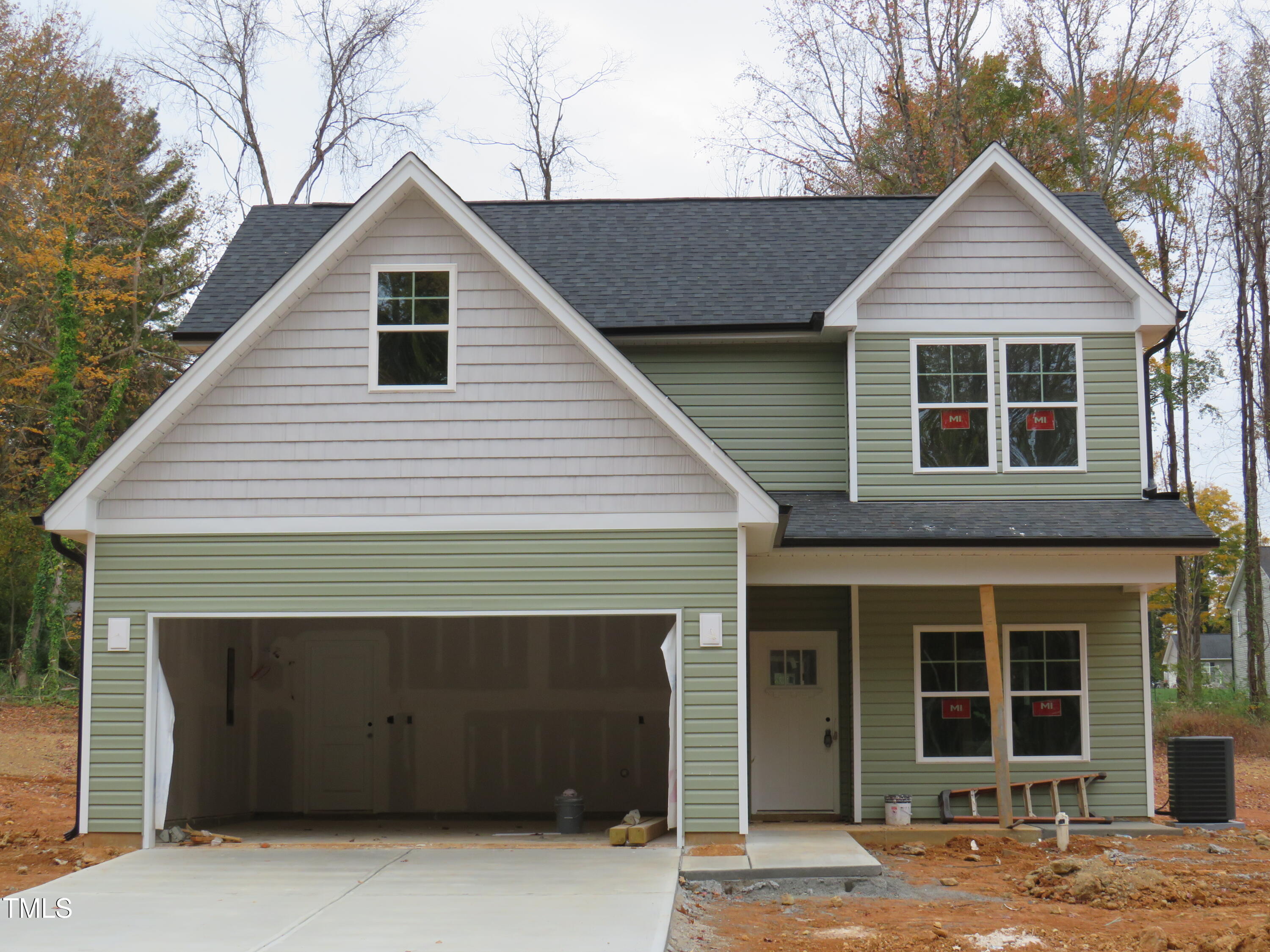 a front view of a house with a garage