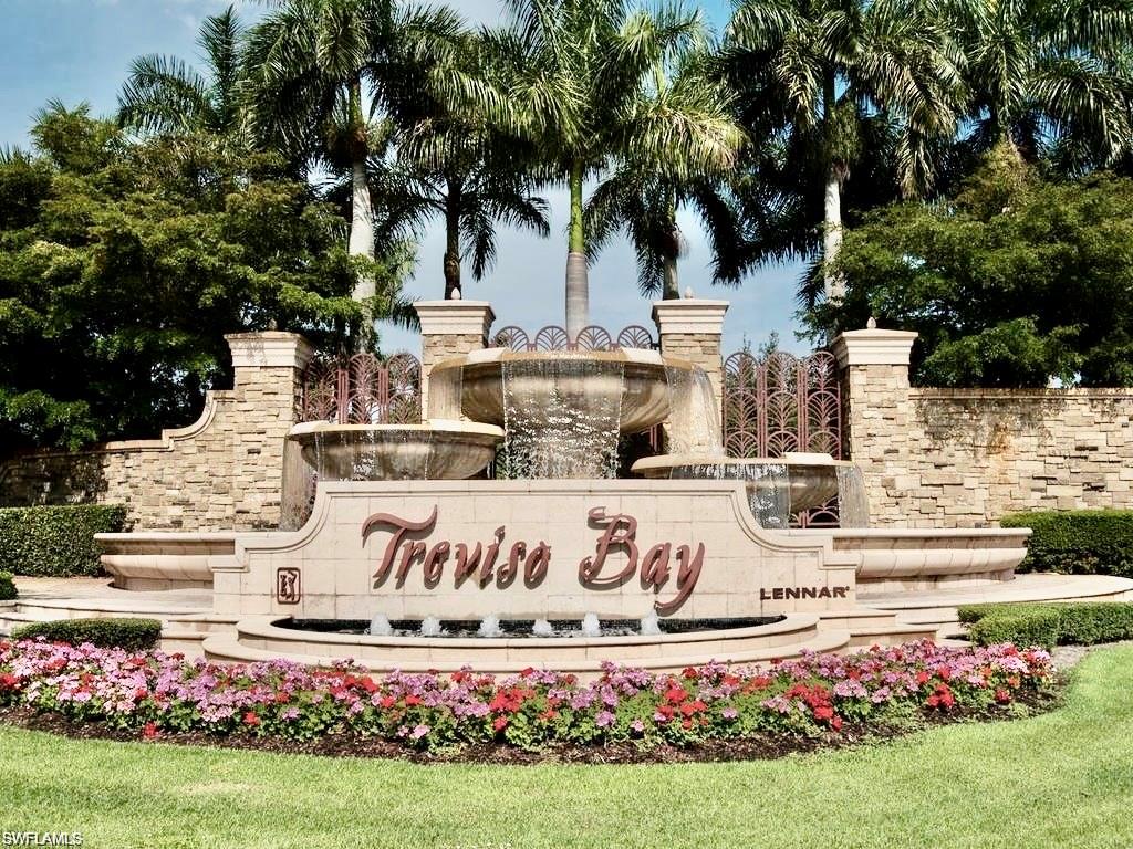 a street sign that is in front of flowers