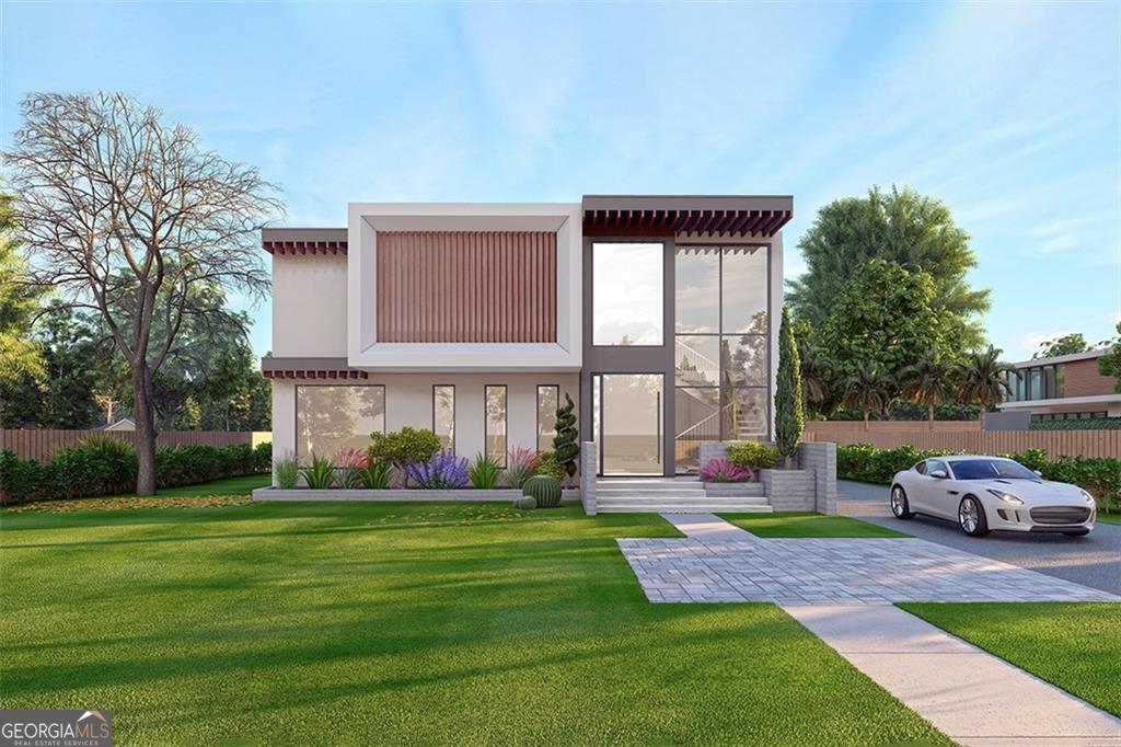 a front view of house with yard and green space