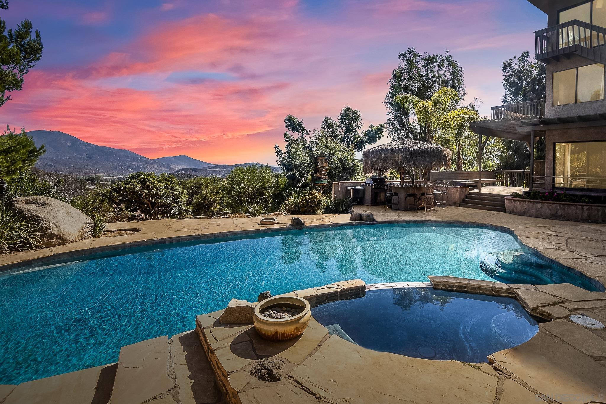 a view of a swimming pool with lounge chair